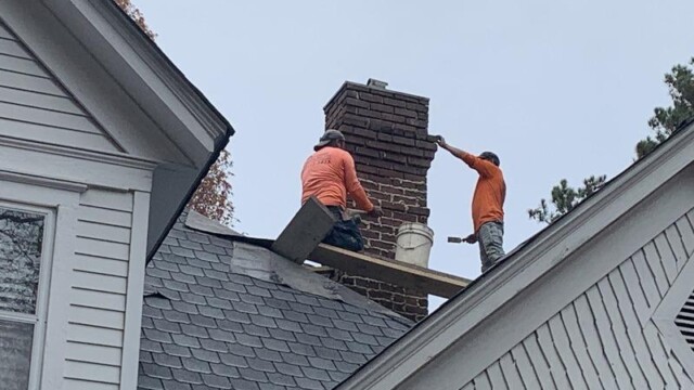 Virginia Stephens House men working on roof