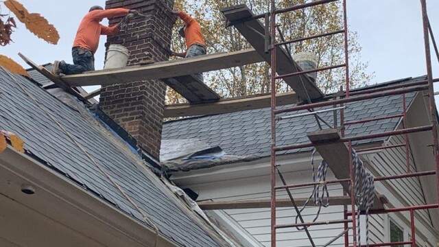 Virginia Stephens House men fixing chimney