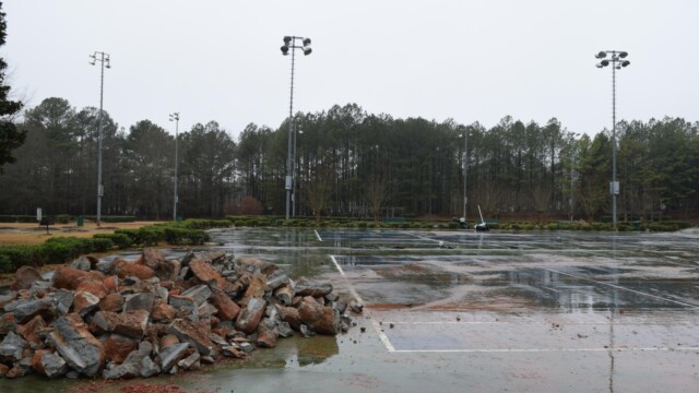 Old concrete chunks piled up from demolition on a rainy day