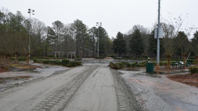 Overcast tire tracks on unfinished access road for demolition