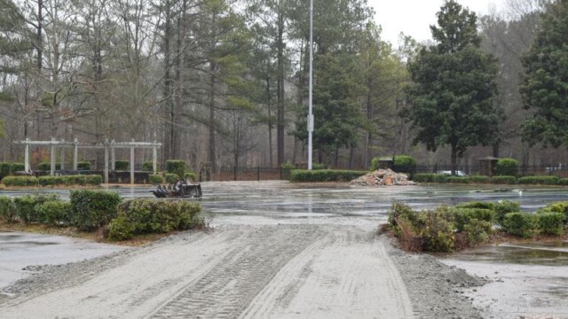 Overcast tire tracks on unfinished access road