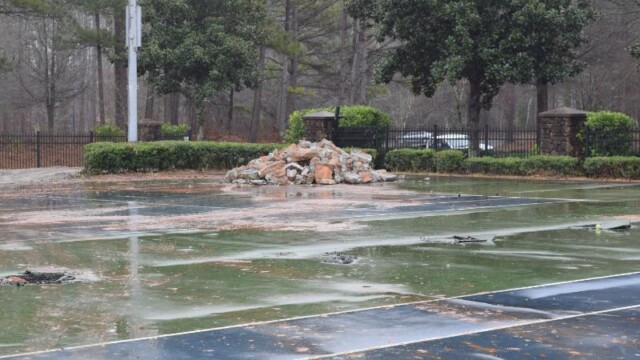 Old concrete chunks piled up in the distance from demolition