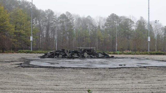 An island of old tennis court surface remains to be demolished