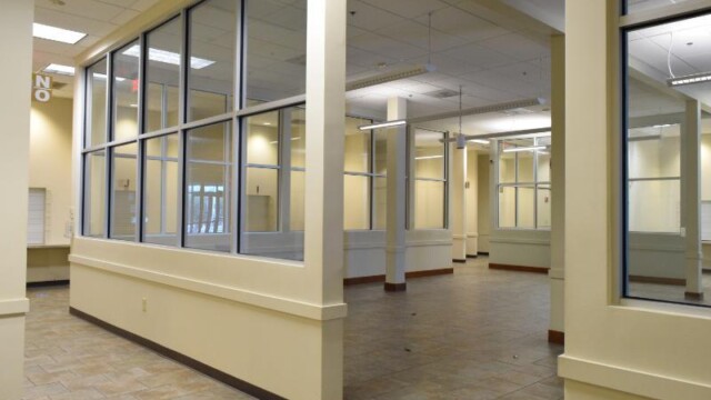view from outside big room with windowed walls surrounding it
