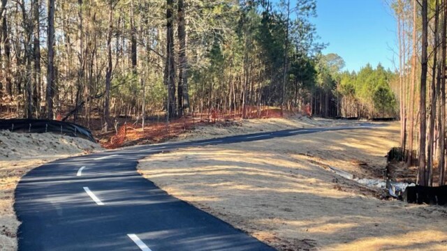 River's Edge Phase 2 curve of path with white dotted lines down the middle