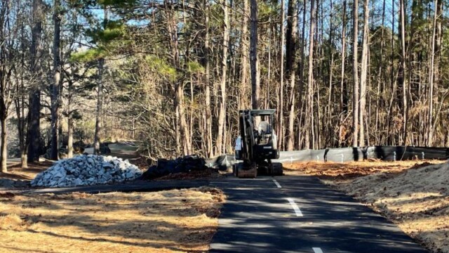 equipment driving down middle of new path