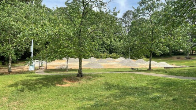 New court surface aggregate rock material piled on site at Flat Shoals Park