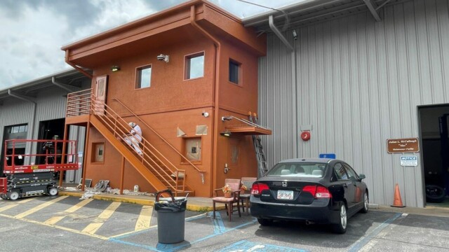 orange section of building that is 2 stories