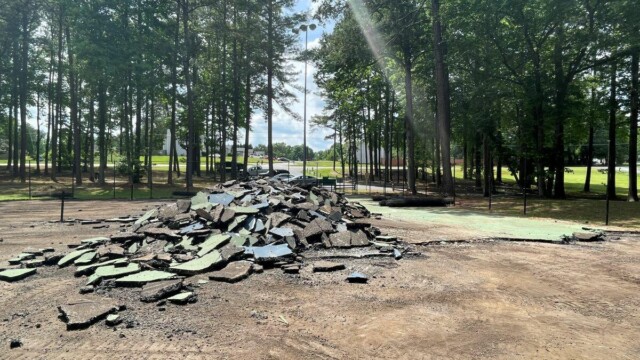 A pile of chunks of demolitioned old court surface debris
