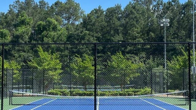 A tennis court with slack in the net at International Park
