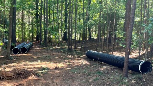 River's Edge II preparing to build path in woods