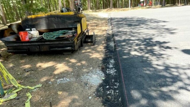 Court surfacing equipment at Independence Park
