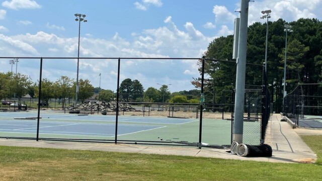 Fencing being installed at Lovejoy Tennis Center