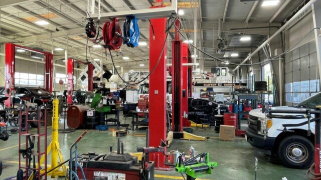 view of new shop showing cars and equipment