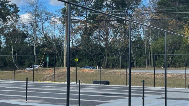 Fenceposts installed at resurfaced tennis court