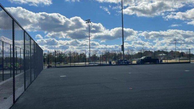 Resurfaced court surface on a mostly sunny day