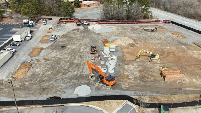 Aerial view of construction site with 2 forklifts from January 2025