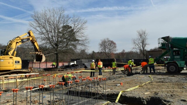 wide view of construction workers at Fire Station 1 site