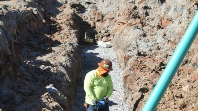 construction worker in ditch