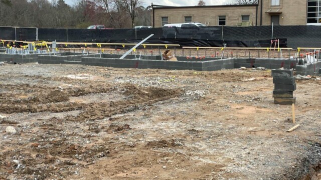 view of 2 layers of cinder blocks as foundation of building