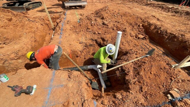 Fire Station 9 - Men Working On Plumbing System Before Foundation Is Set - Clayton County Fire Station 9 - Men Working On Plumbing System Before Foundation Is Set