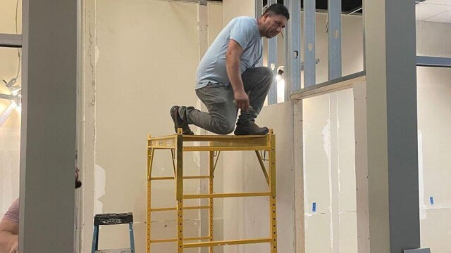 Small Business Incubator SPLOST update man on scaffold