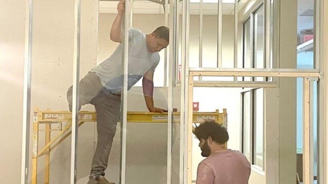 Small Business Incubator SPLOST update two men framing room