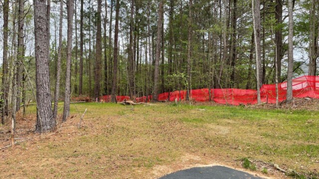 River's Edge Phase 3 construction empty space surrounded by trees