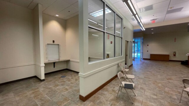 room with 3 walls and help desk window