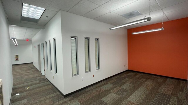 Small business Incubator corner office with orange wall