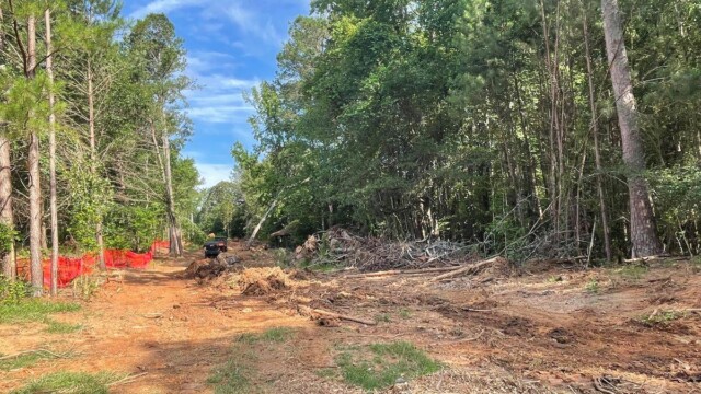 River's Edge Phase IV pathway with dirt mound in the middle