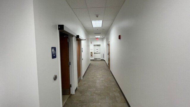 Small business incubator November with hallway, restrooms and exit door