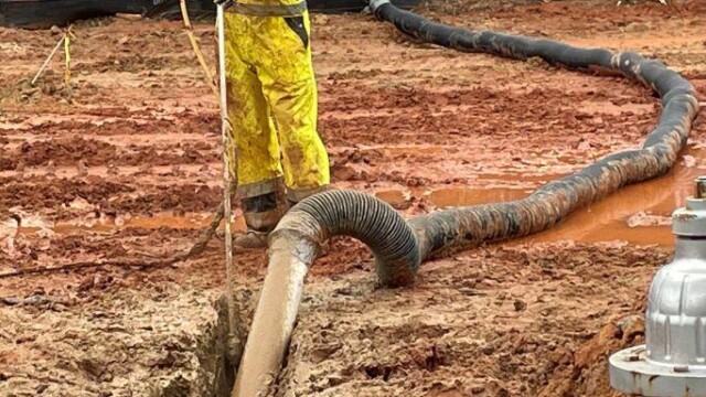 Lakeview updates man standing with hose