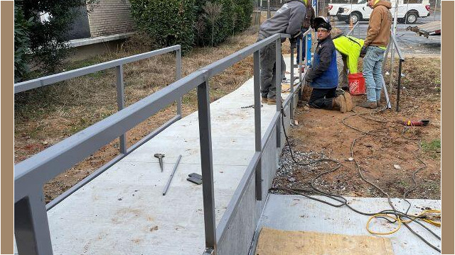 Shelnutt Senior Center men working on railings