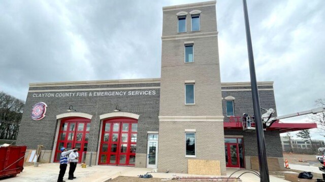 Fire station 9 - Building Front View With Workers Fire station 9 - Building Front View With Workers