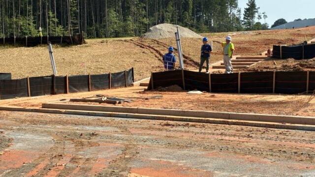 District 3 Pocket Park men working on stairs
